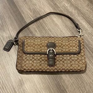 Coach wristlet with snap pocket